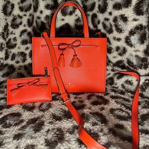 Reddish/orange Kate Spade purse and matching wallet!